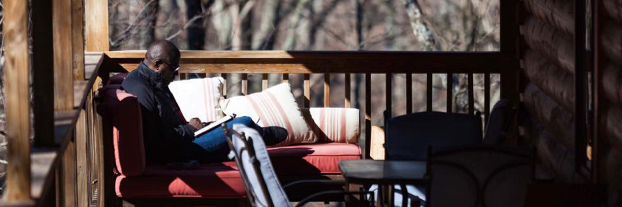 8 Things I Do When I Disappear Because of My Autism Lamar Hendricks Reading on porch