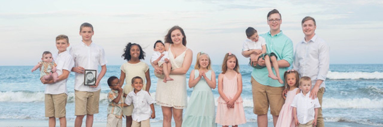 Treasures in Adopting a Child With a Disability Large family photo