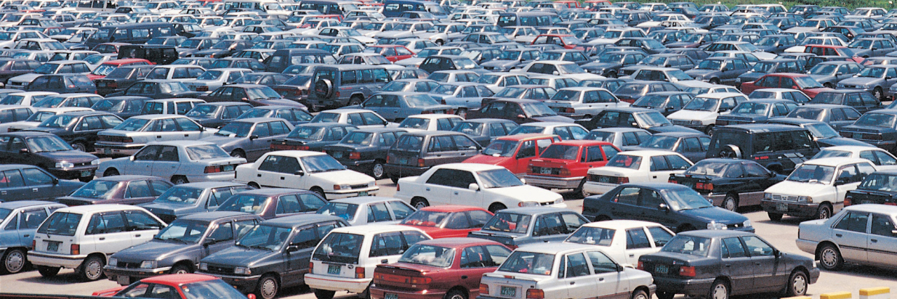 Addressing People's Responses to My 'Invisible' Brain Injury Busy parking lot full of cars.