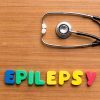 Epilepsy colorful word on a wooden background.