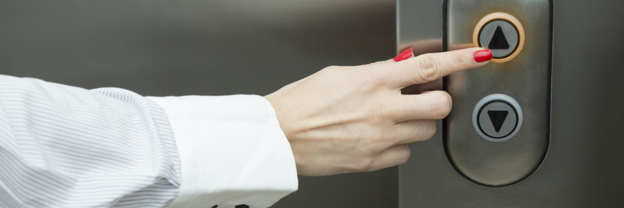 Why 'Elevators Are for Wimps' T-Shirts Are Offensive woman pressing elevator button
