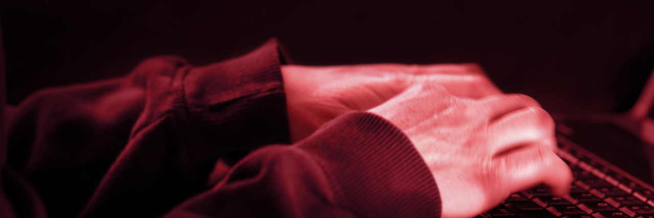 Being Bullied Online by a Mast Cell Activation Disorder Support Group anonymous person typing on a computer