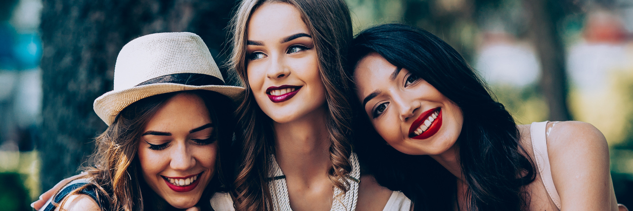 How You Can Support Me as I Live With Chronic and Mental Illnesses Three friends smiling at the park.