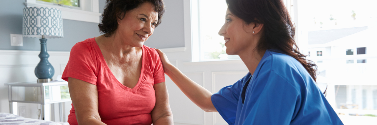 How to Stay Healthy as a Dementia Caregiver nurse visiting and caring for senior woman