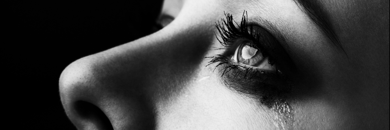 When Cystic Fibrosis Left Me Crying on the Bathroom Floor A black and white photo of a woman crying.