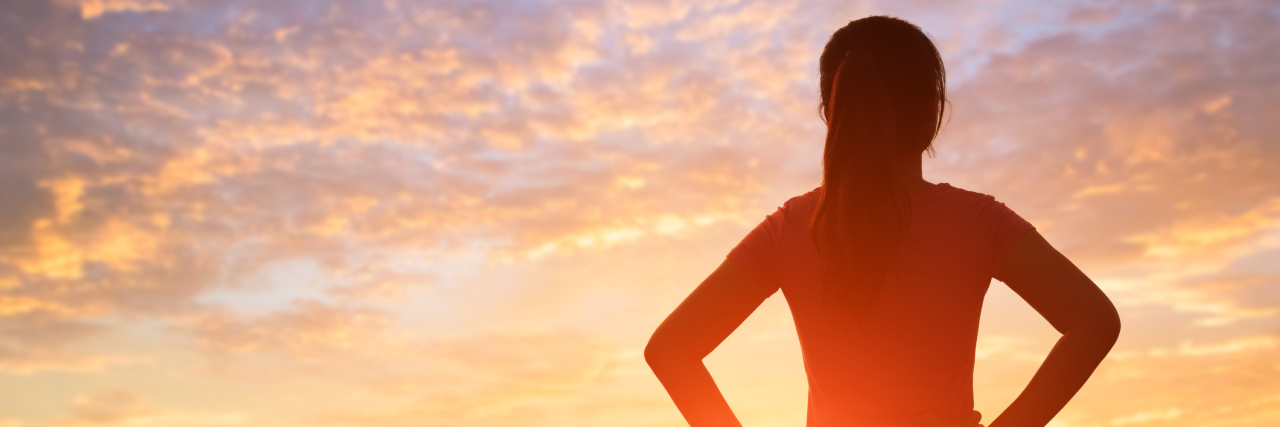 How I Learned to Find Joy in My Pain as Both My Parents Fought Cancer silhouette of woman with sunlight