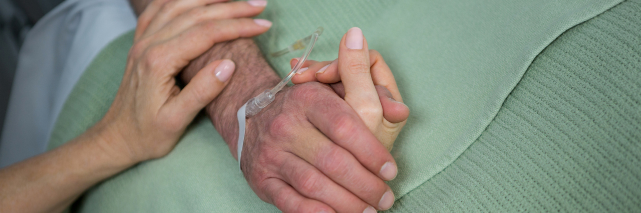 I Never Thought I'd Be in That Place as My Husband Fought Cancer Doctor consoling a patient in hospital