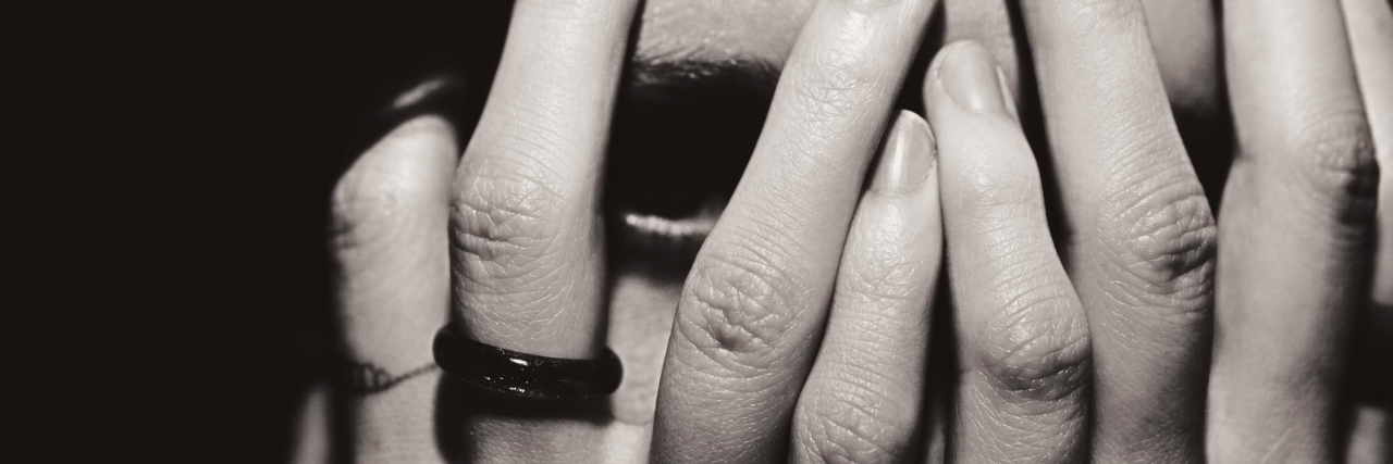 How to Support Someone With 'Hidden' Depression Portrait of a woman covers her face with hands