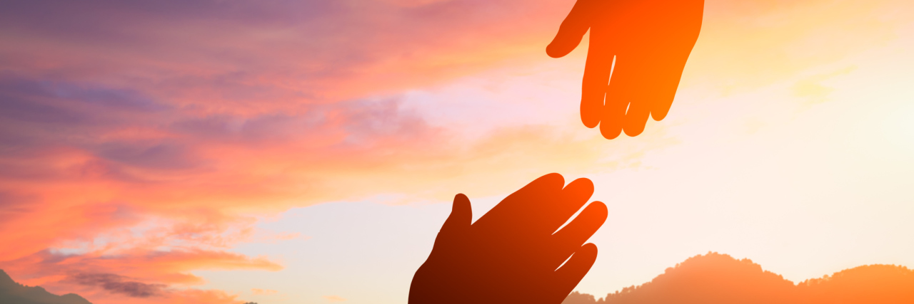 Breast Cancer Changed the Way I Viewed My Mom helping hand with the sky sunset background