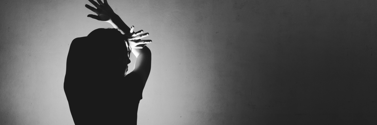 What I Think and Feel Before, During and After My Panic Attack woman afraid of something, covering face and head with light behind in white tone