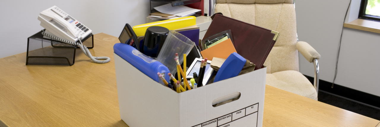 Employment Discrimination Based on Muscular Dystrophy Box of office supplies on desk.