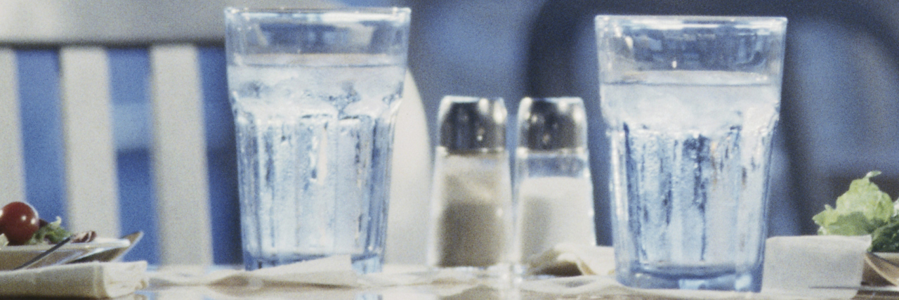 Things That Help Me Cope With Dysphagia Glasses of water on a table in a restaurant