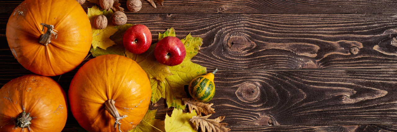 Who I Am Grateful for as Someone With Rheumatoid Arthritis pumpkins on a wooden table