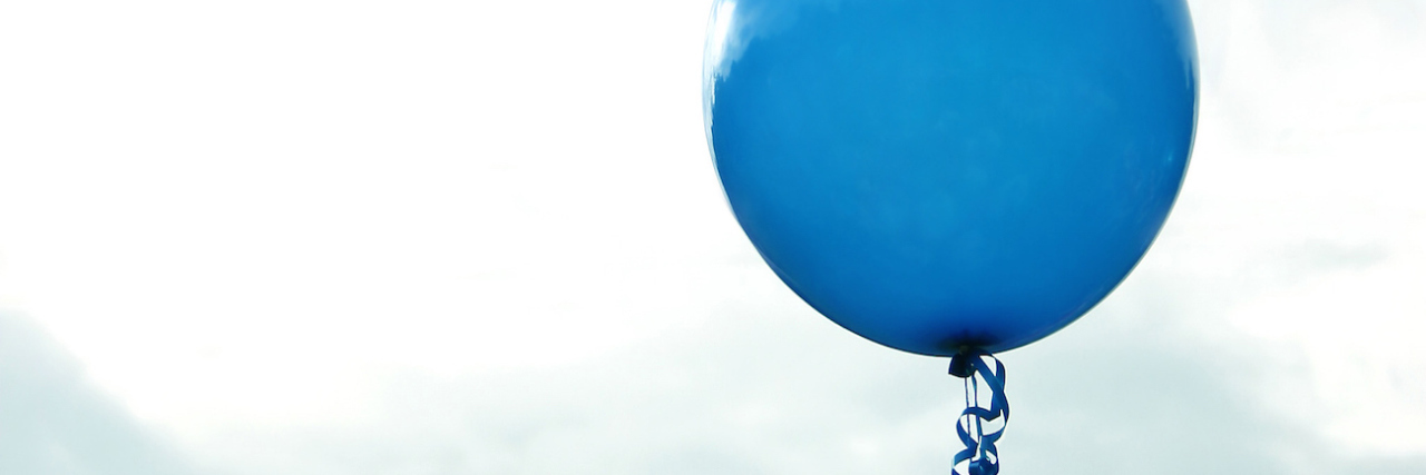 Grief and Loss: Honoring My Mother on Her Birthday blue birthday balloon against sky with clouds