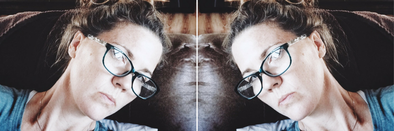 Fibromyalgia, Lyme Disease: The Pros and Cons of Getting a Diagnosis mirror images of a woman wearing glasses and lying on her couch