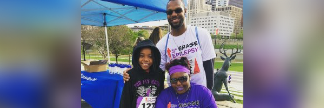 The Importance of Sharing Your Story for Epilepsy Awareness Month man, woman and a young girl wearing epilepsy awareness shirts