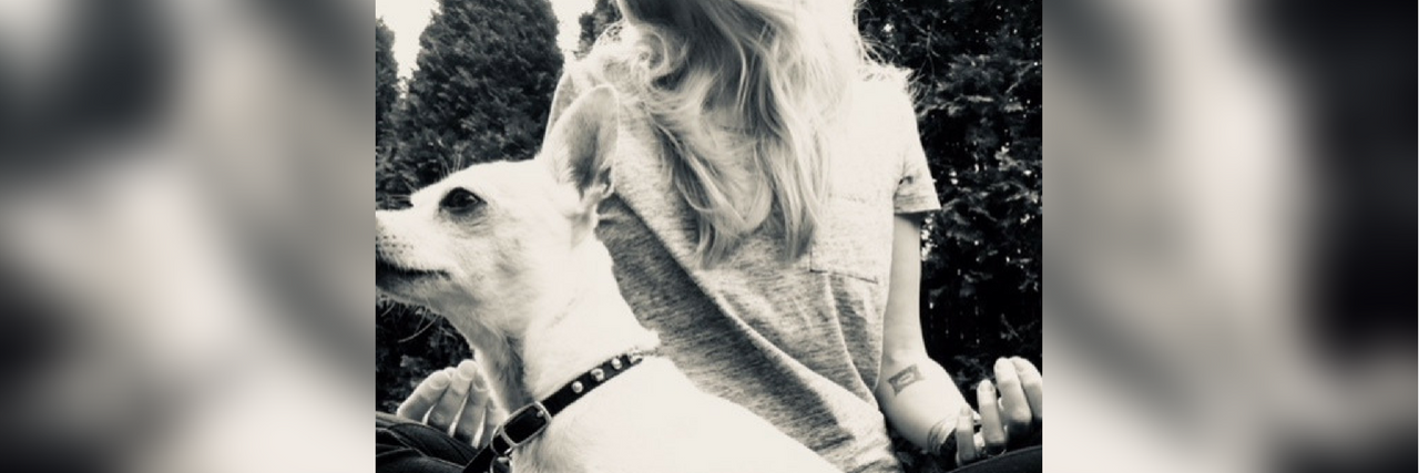 Committing Myself to Taking Care of My Body With Lyme Disease photo of a woman sitting outside with her dog