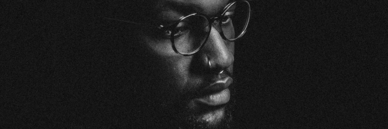 Why the #TyreseChallenge Is Not Funny black man wearing glasses standing in darkness