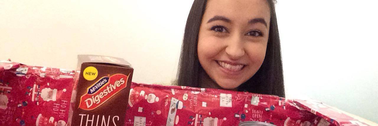 Advent Calendar Alternative for People With Dietary Restrictions girl holding box of food to donate