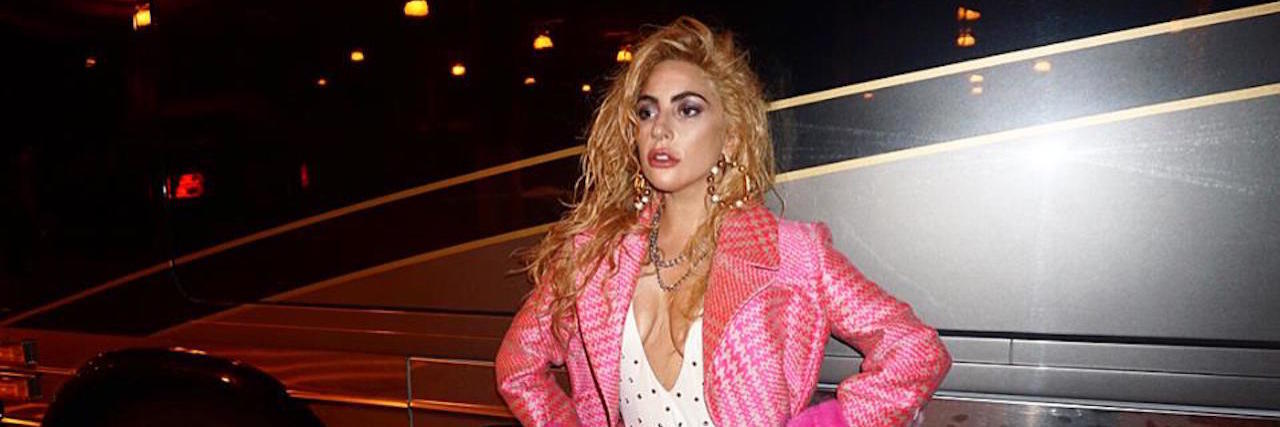 What to Remember as Lady Gaga Continues Tour After Fibromyalgia Flare lady gaga posing in a long pink coat