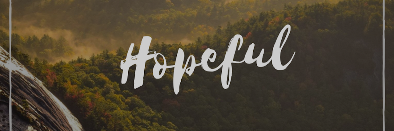 picture of mountains with the word 'hopeful'