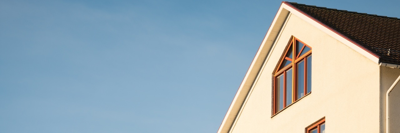 How Chronic Illness and Caregiving Is Like an Extension Cord roof and side of house with blue sky