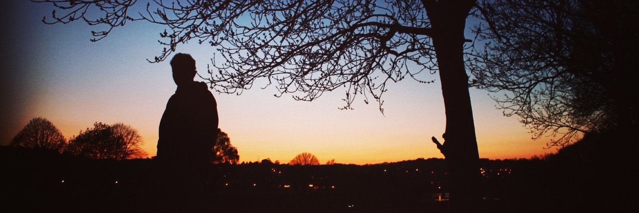 4 Reasons I'm Grateful for My Struggles With Mental Illness sunset with shadow of trees and person