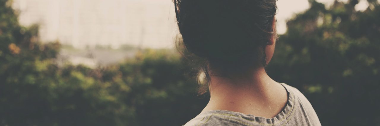 Ways I Wish My Parents Behaved Differently to My Mental Health faded photo of young woman looking off into distance