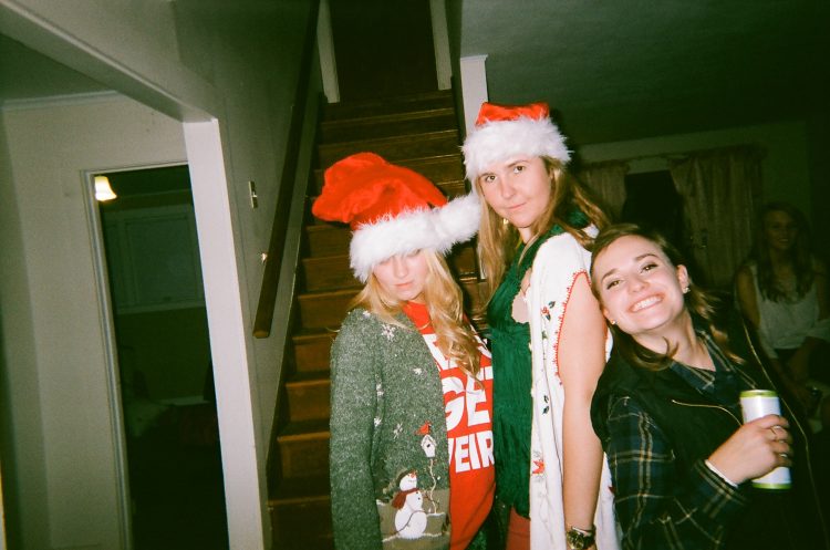three friends at a christmas party