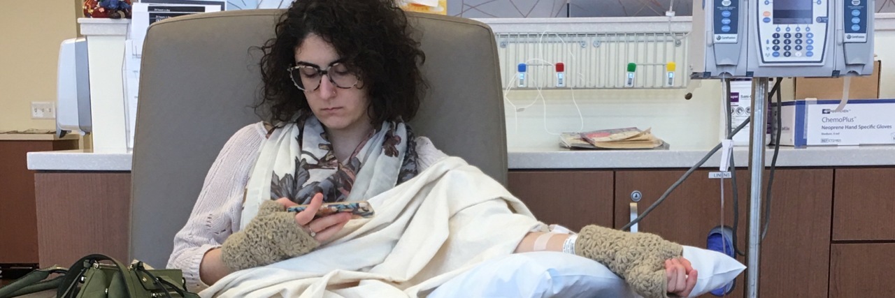 Accepting My Chronic Illness Doesn't Mean I've Given Up woman receiving an infusion
