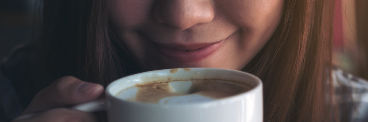 21 Gentle Self-Care Resolutions to Make in 2018 a woman sipping coffee