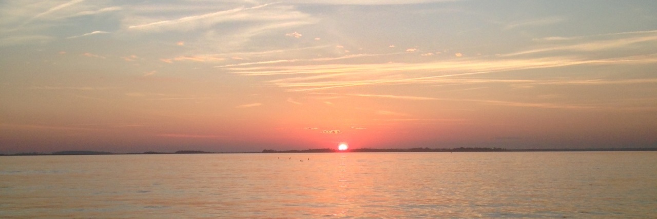 Finding the Magic of the Holiday Season With Lupus sunset over the ocean