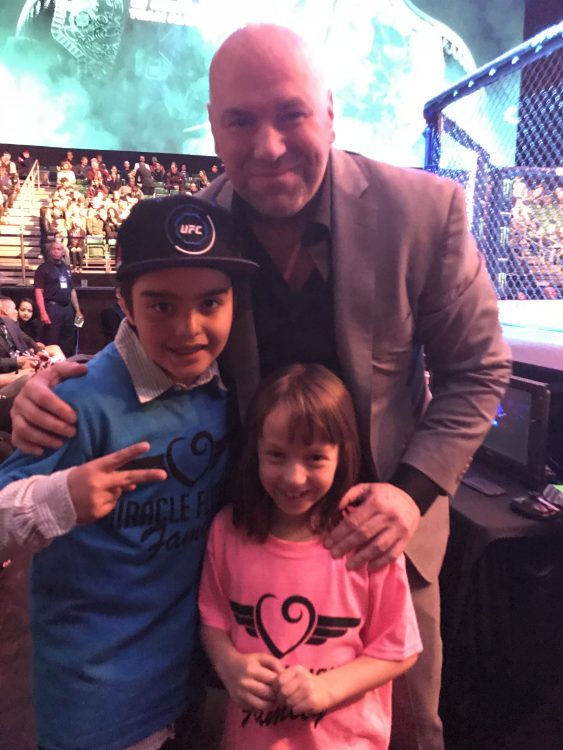 man standing with Miracle Fighters kids