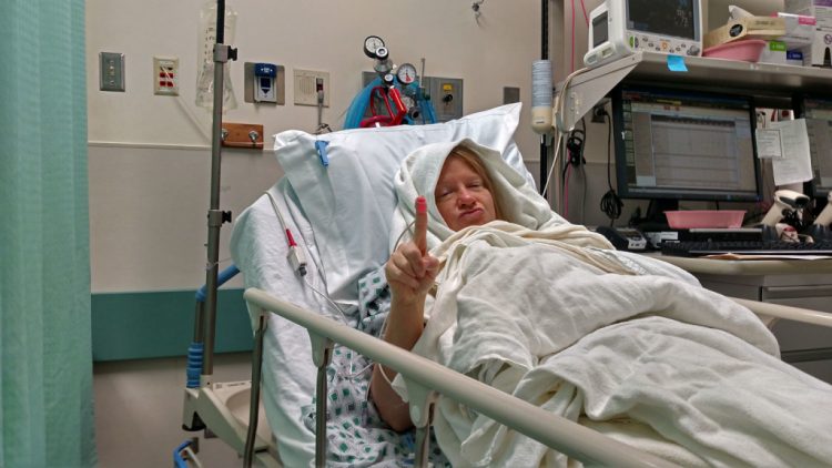 Debbie Spivey after surgery in bed