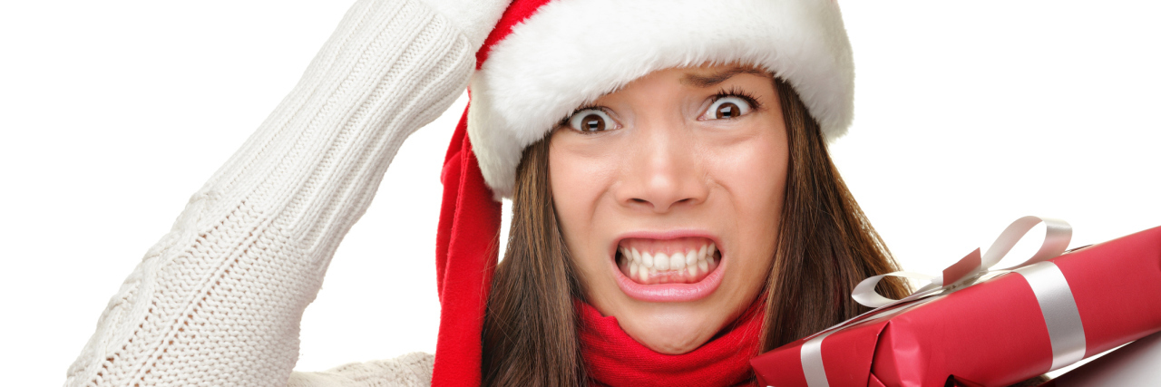 Holidays After a Traumatic Brain Injury Christmas stressed out woman.