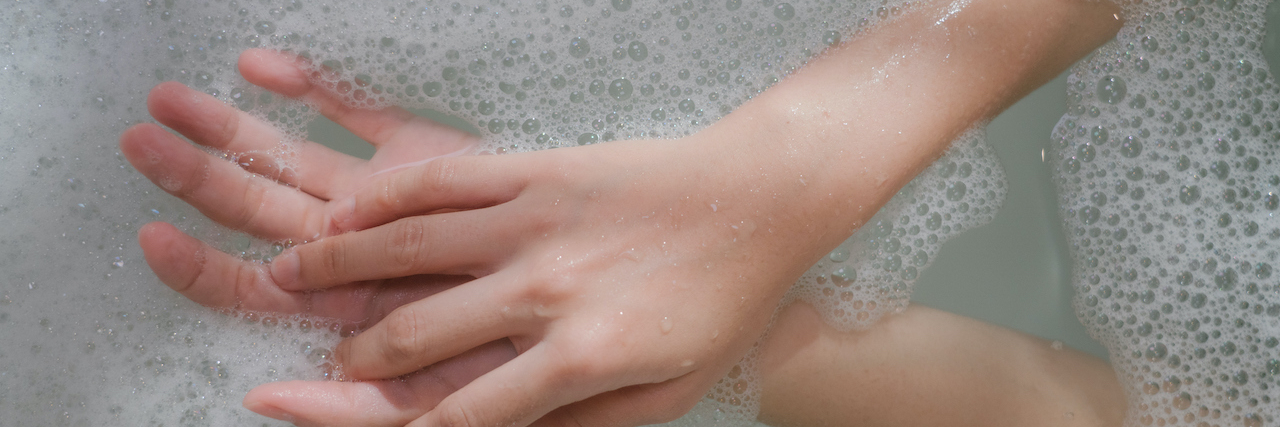 15 'Hygiene Hacks' for When You're Depressed Hands in water surrounded by bubbles