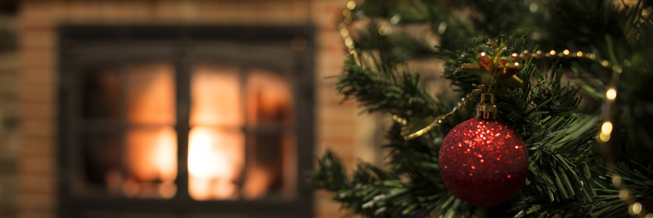 My 12 Days of Christmas With Breast Cancer Close-up of ornaments on the Christmas tree near a fireplace
