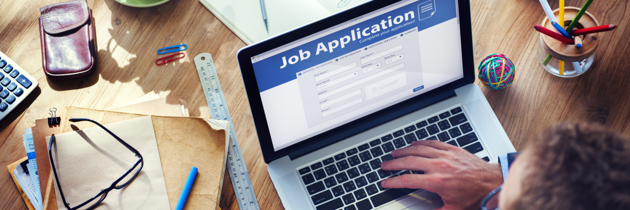 Finding a Job After Brain Injury Man applying for a job on the Internet.