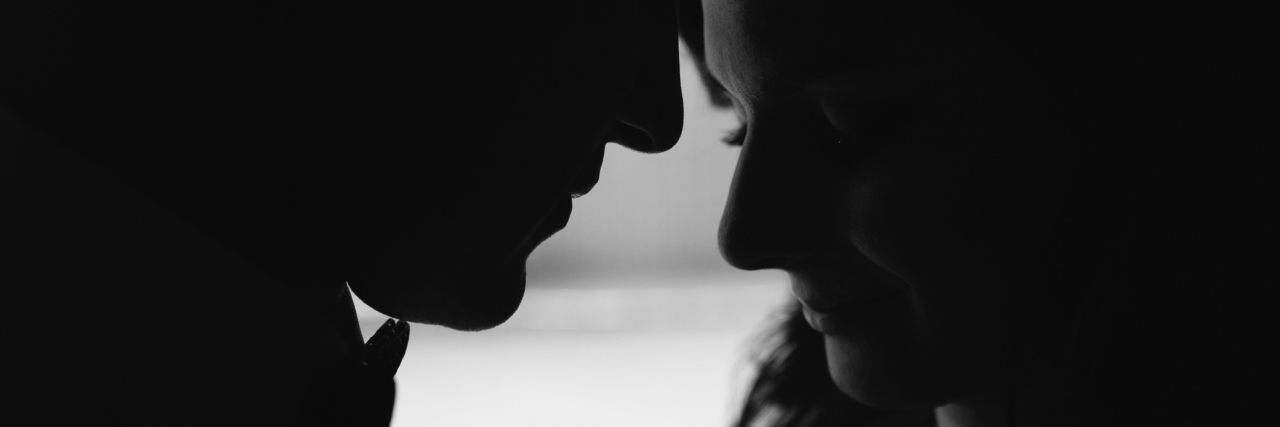 Lessons Learned By a Caregiver Taking Care of His Wife A young couple with their foreheads touching, black and white.