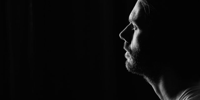 How the Mental Health System Failed My Brother Who Lived With Schizophrenia man looking away