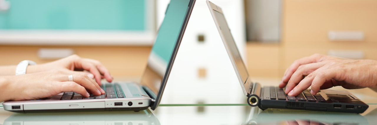 Job Hunting as an Adult With Autism and Anxiety woman and man at home typing on laptop computer