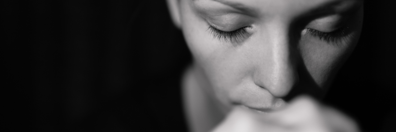 9 Things I'm Thankful for as Someone Struggling With Mental Illness Portrait of young woman praying.