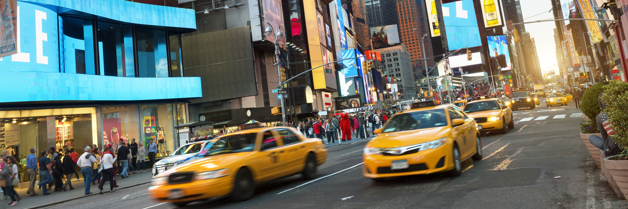 Documentary Shows Wheelchair Inaccessible NYC Transportation Taxis in Times Square, New York City.