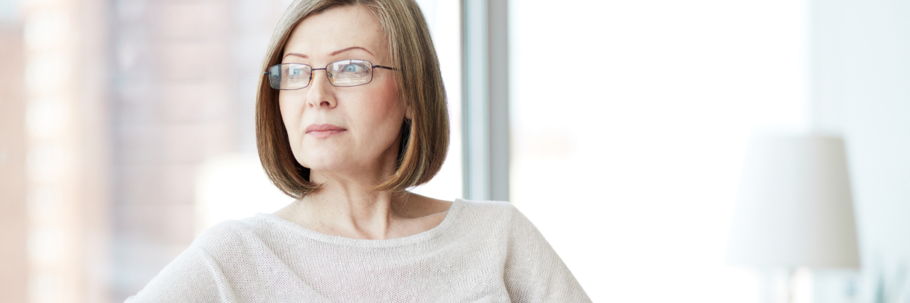 Not Going Out and Celebrating New Year's Eve Due to Asthma woman reading a book on her couch at home