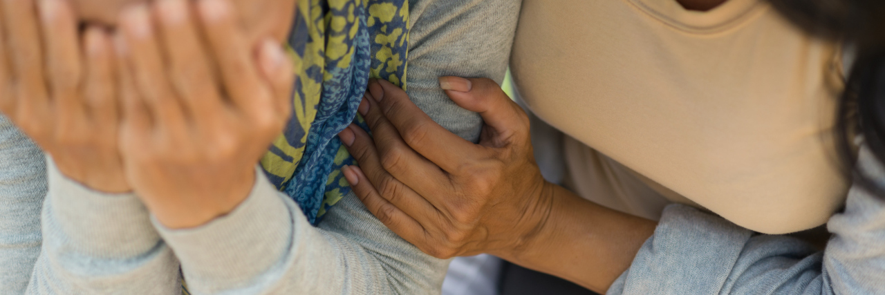 Minorities Who Experience Miscarriage Need Better Mental Health Care Woman comforting desperate hopeless friend, view from above