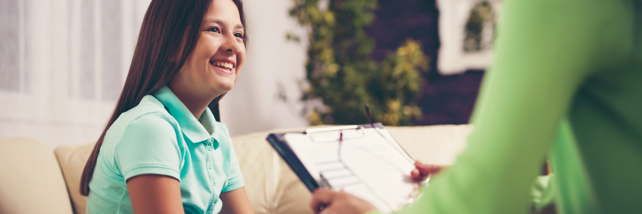 Would My Mental Illness Make Me a Better Counselor? Girl teenager is happy after a successful therapy by psychologist counselor