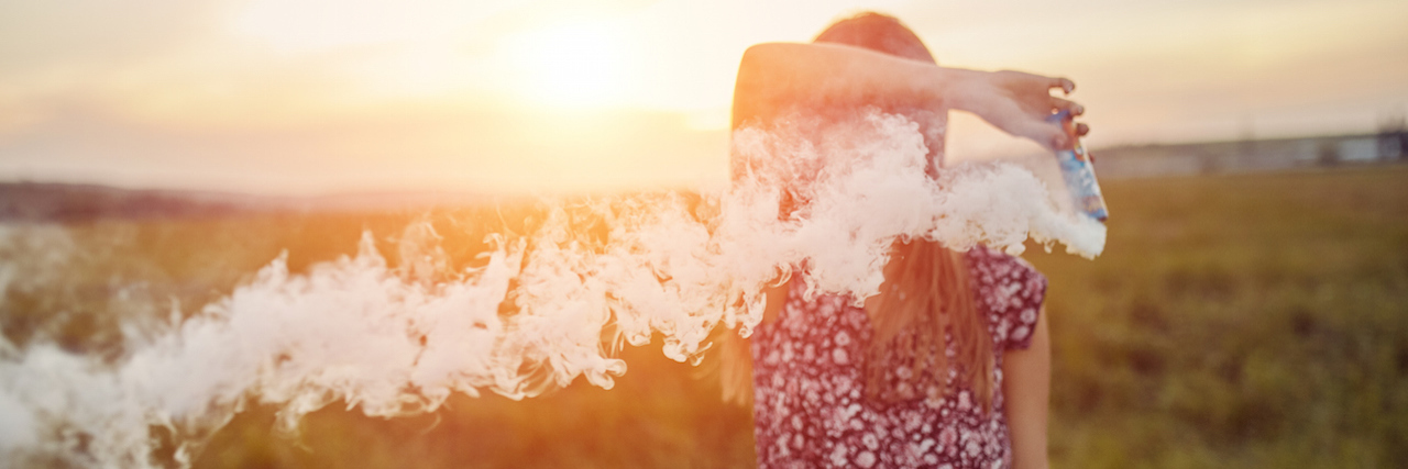 I'm Afraid My Anxiety Will Make My Boyfriend Break Up With Me A woman holding a candle