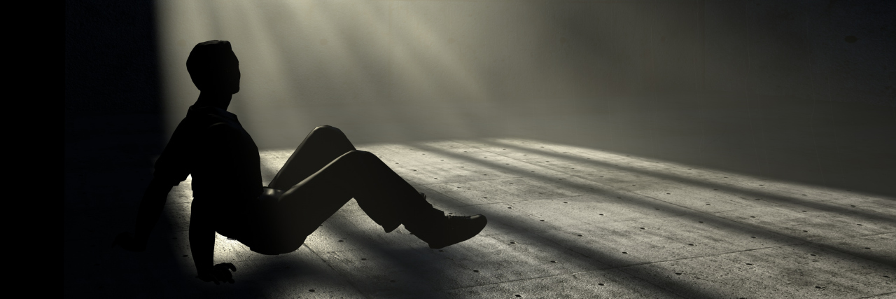 The Isolation of Living With Chronic Pain man in a prison cell