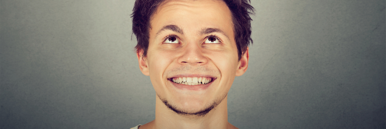 Overhearing Comments About My Short Height Portrait handsome smiling young man looking up