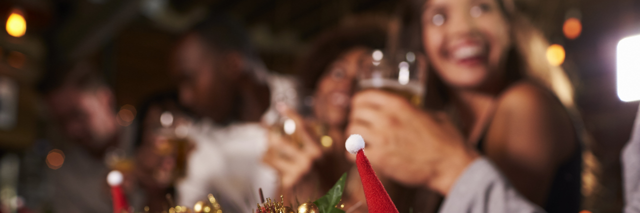 5 Ways I Cope With Holiday Anxiety Christmas party at a bar, focus on foreground decorations
